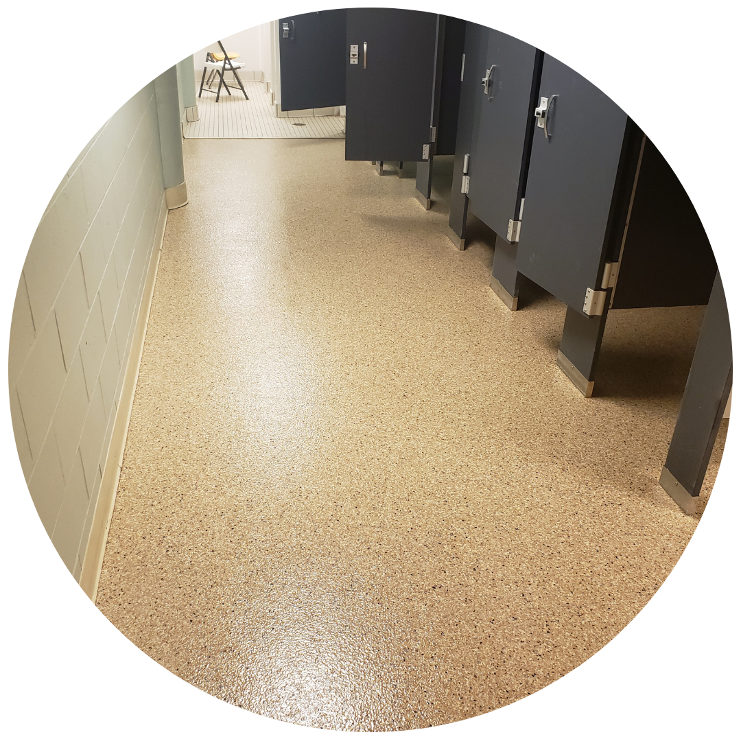 commercial and residential epoxy floor concrete coating in Piqua Locker Room Concrete Coating Circle Image