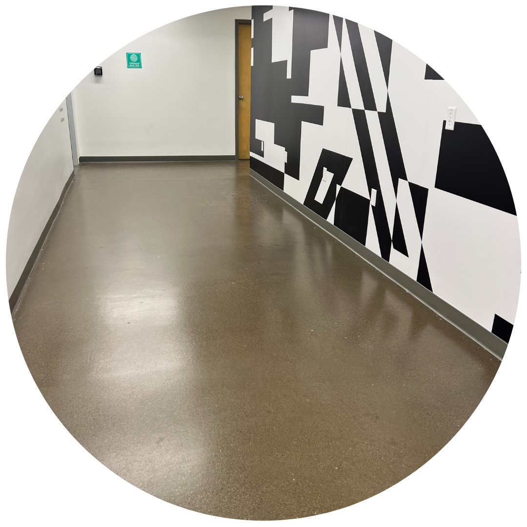 commercial and residential epoxy floor concrete coating in Piqua Locker Room Concrete Coating Circle Image