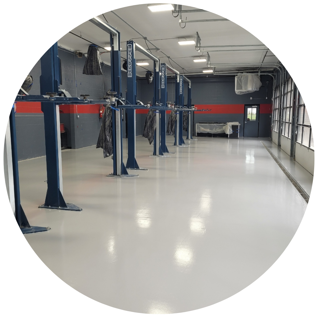 commercial and residential epoxy floor concrete coating in Piqua Locker Room Concrete Coating Circle Image